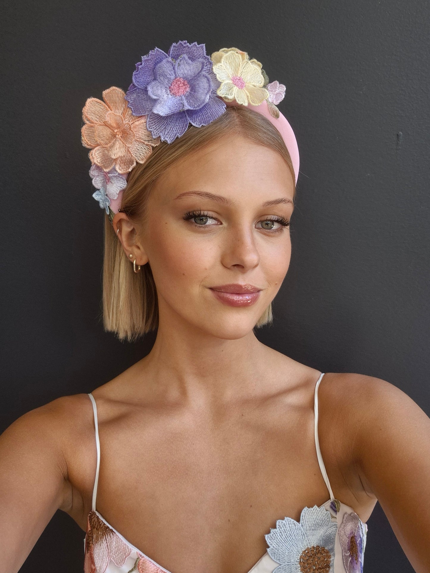 model wearing floral lace headband