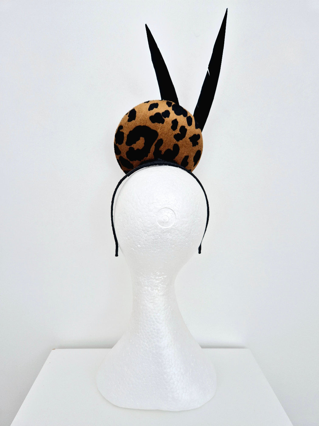 animal print percher with feathers back view