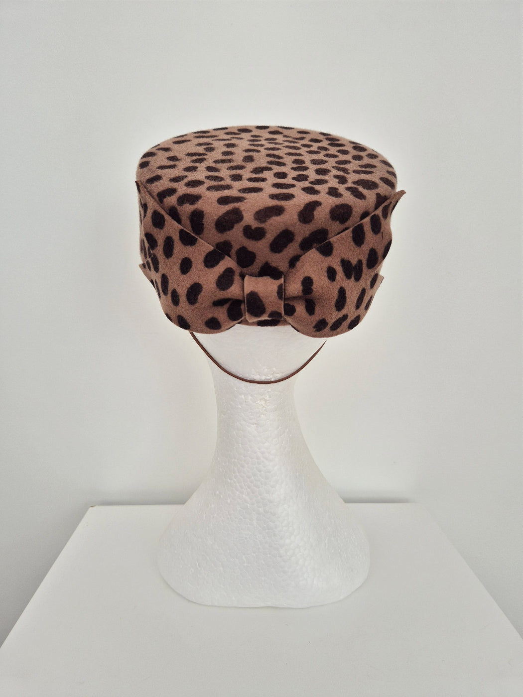 animal print pillbox headpiece with bow back view