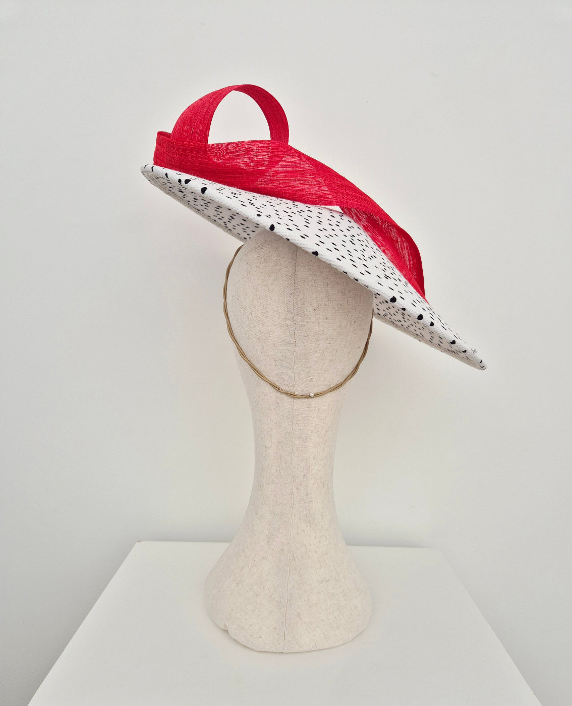 back view black and white polka dot coolie hat with red loopy tail