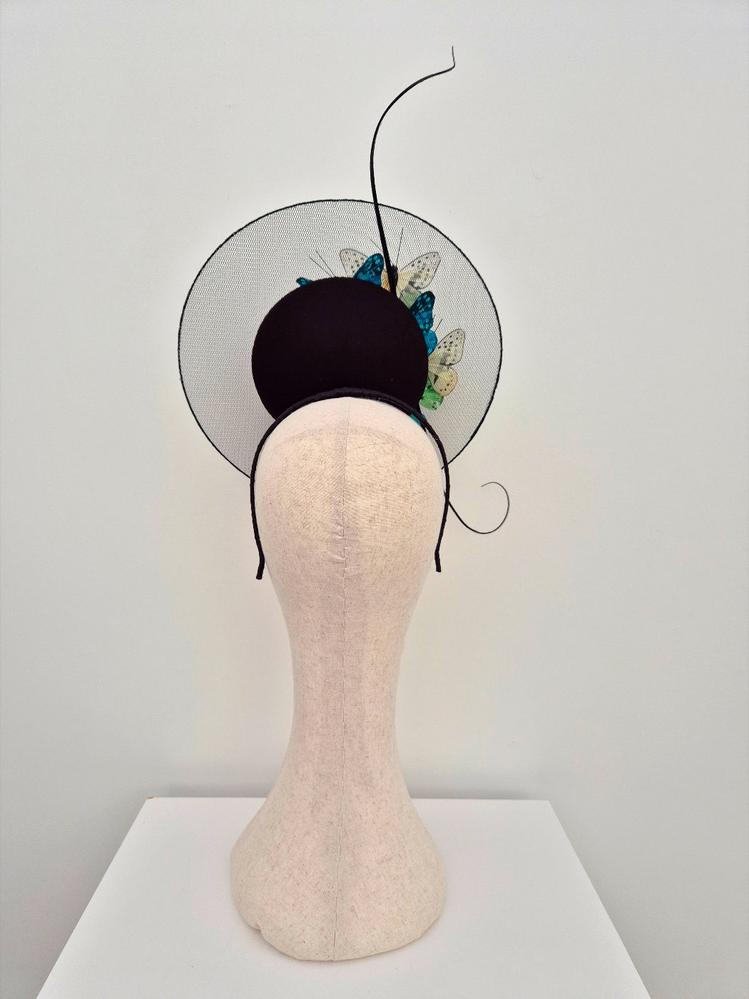 back view black percher with butterflies