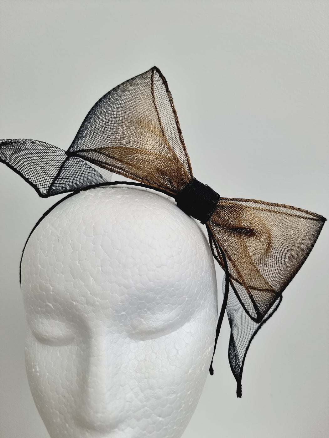 black and gold bow headband close up