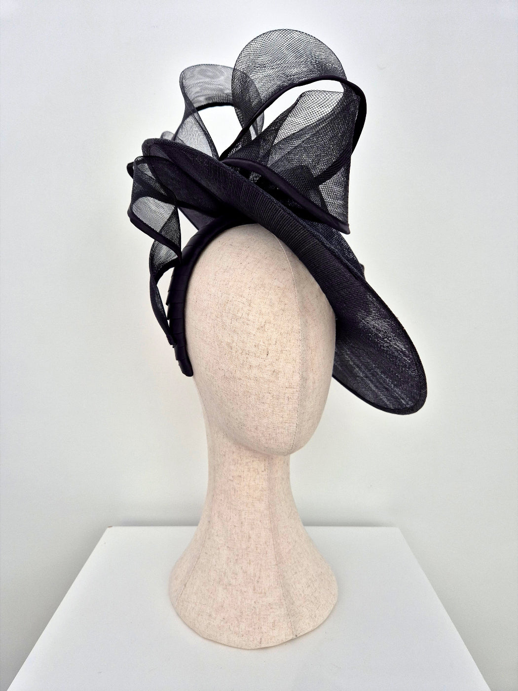 black boater style hat with bow side view