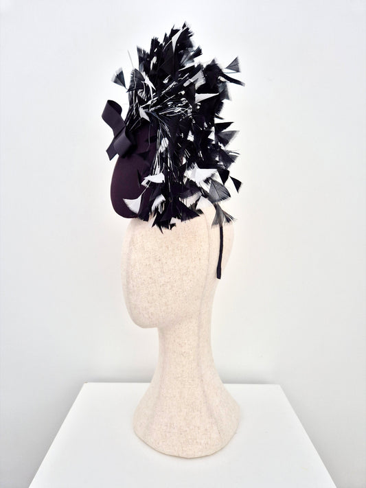 black headpiece with black and white feathers side view