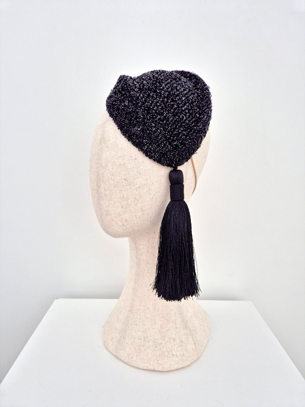 black hostess headpiece with black tassel side front