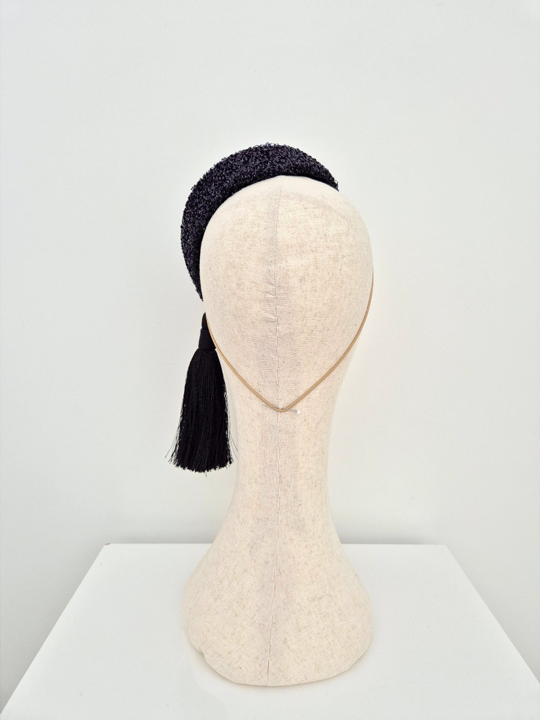 back view black hostess headpiece with black tassel
