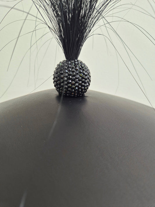 black leather coolie hat close up