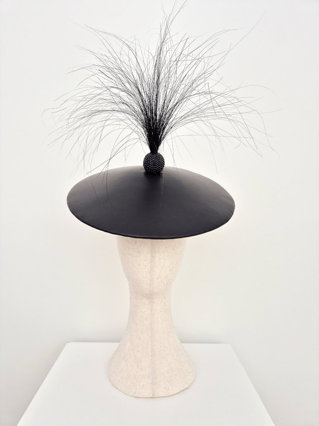 black leather coolie hat with feathers
