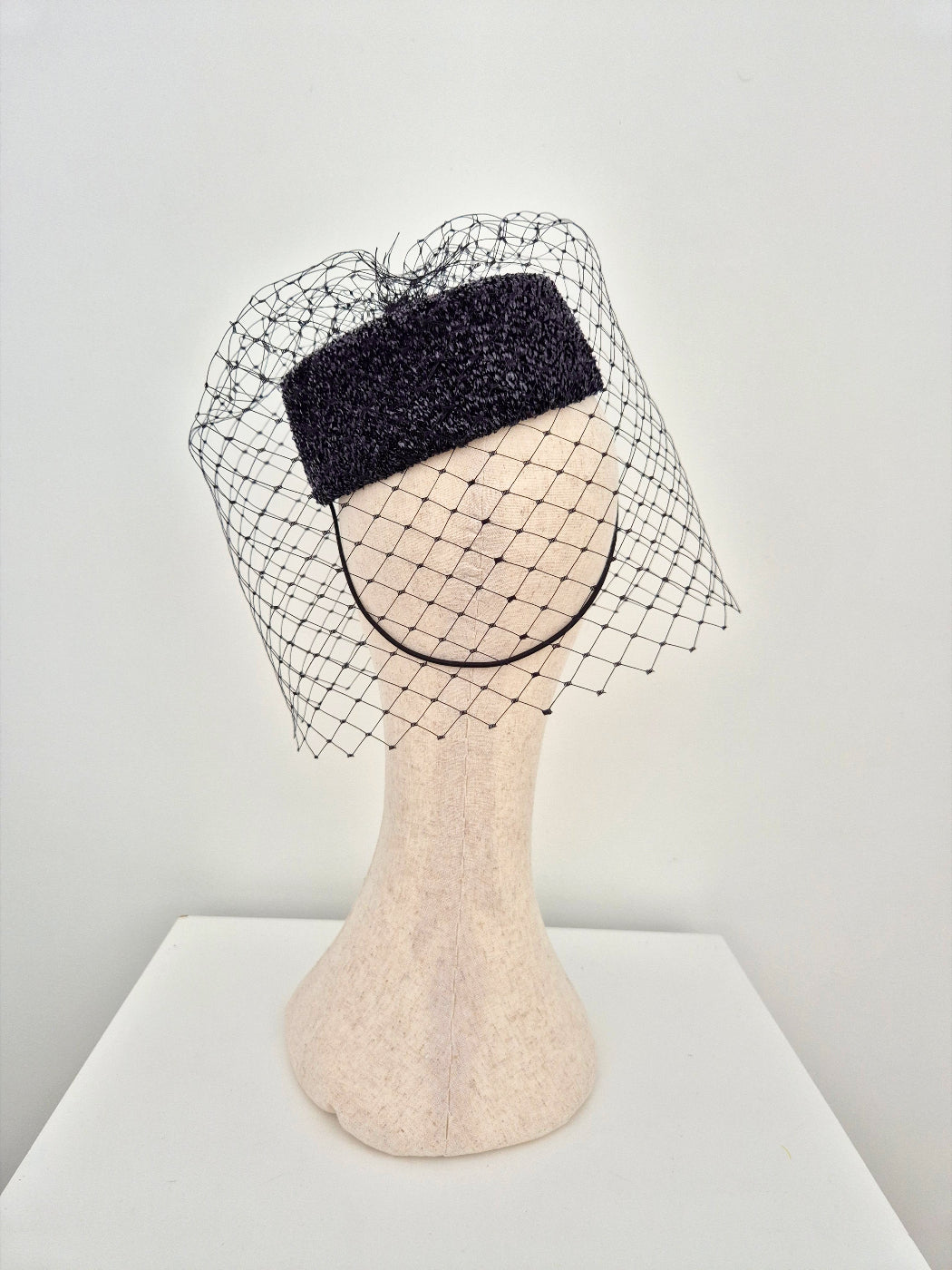black pillbox headpiece with veiling back view