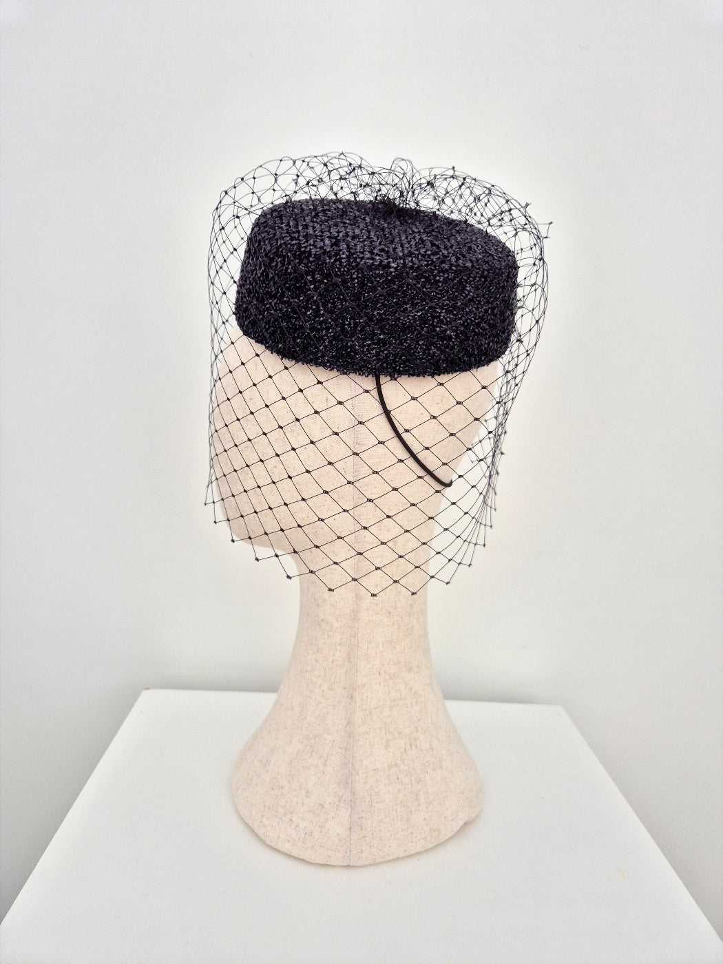 black pillbox headpiece with veiling side view