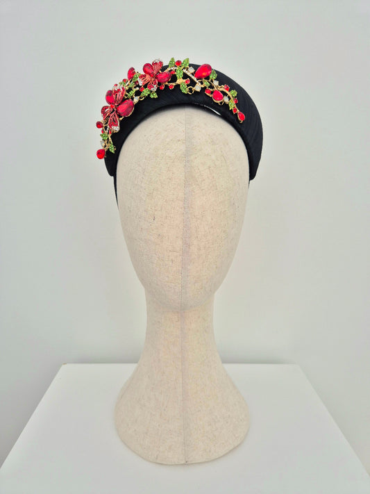 black silk crescent headpiece with red rhinestone floral embellishment