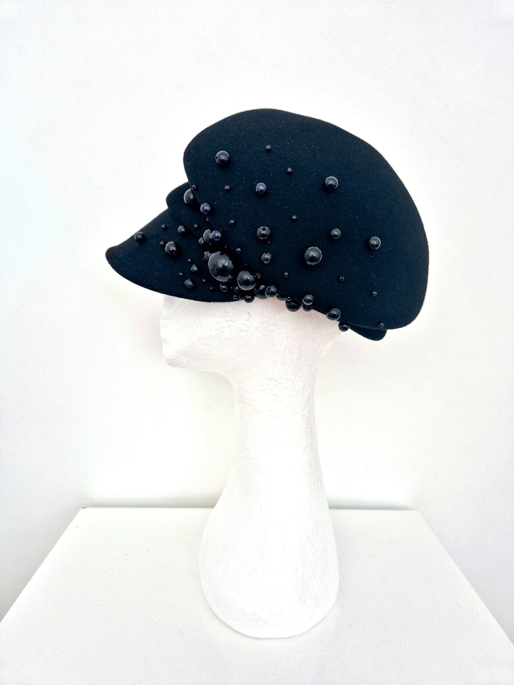 black wool cap with pearls side