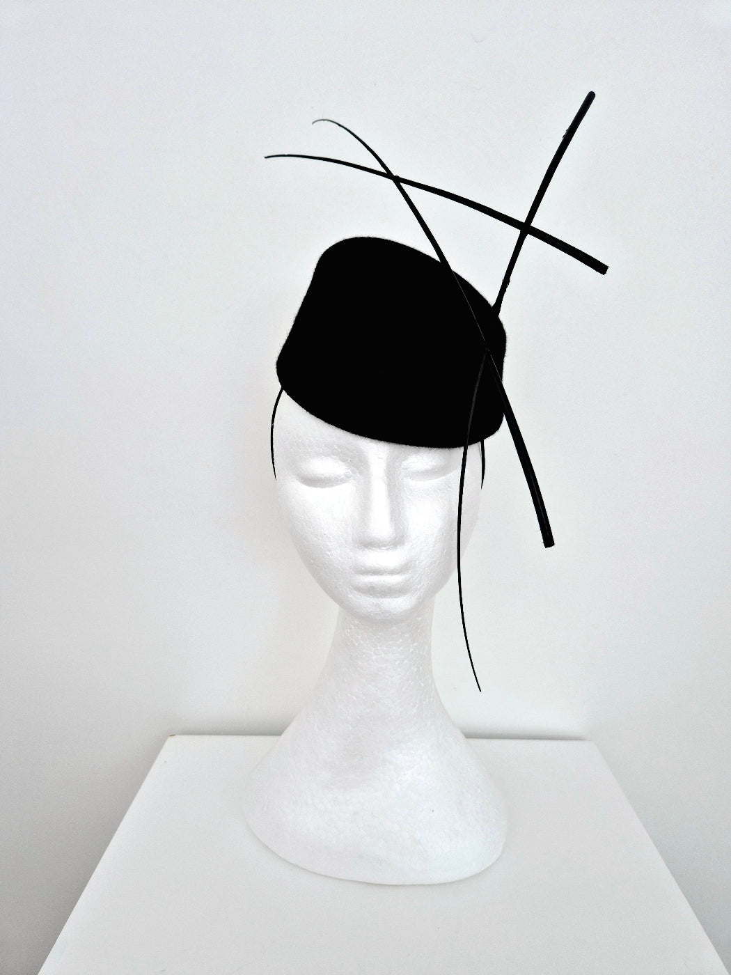 black wool felt headpiece with quills