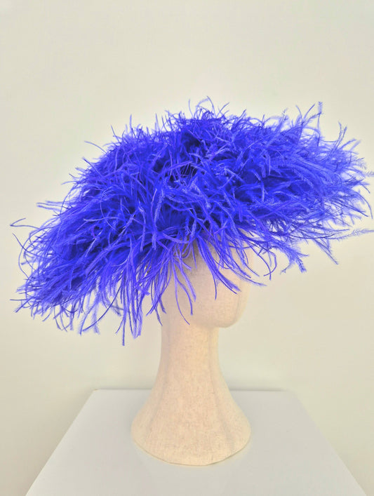 side view 2 bright blue feather hat