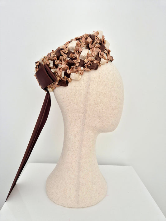 brown and cream rear sitting pillbox headpiece with ribbon bow and tails side view