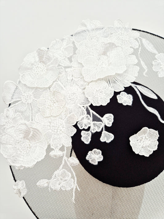 close up black and white floral lace headpiece percher