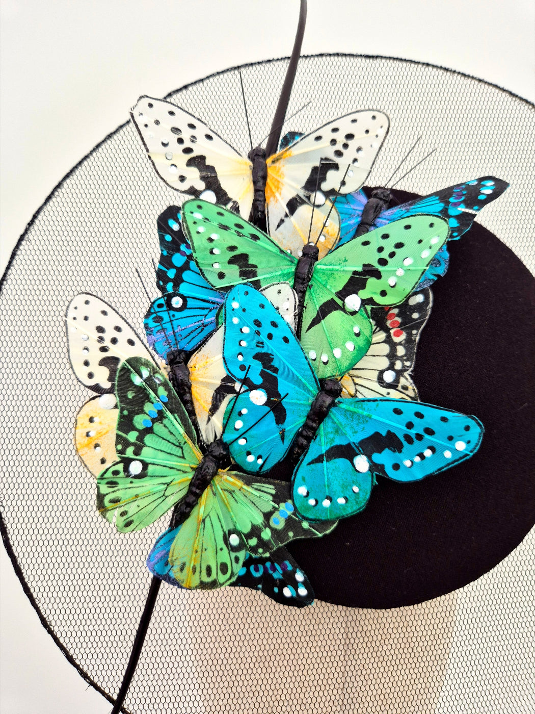close up butterflies on black percher headpiece