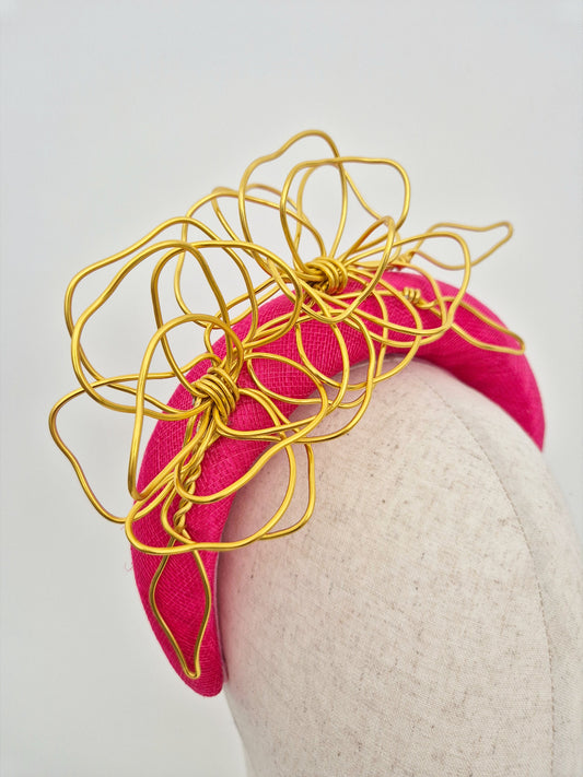 close up hot pink headband with gold floral wirework