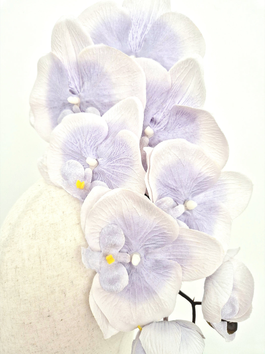 close up lavender orchid headpiece