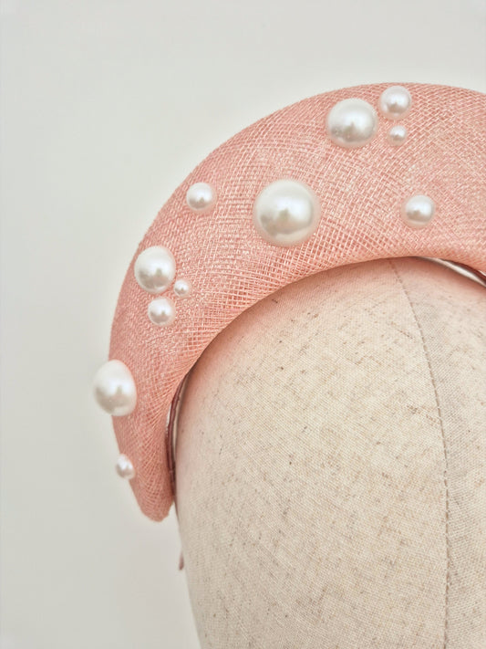 close up light pink straw halo with pearls
