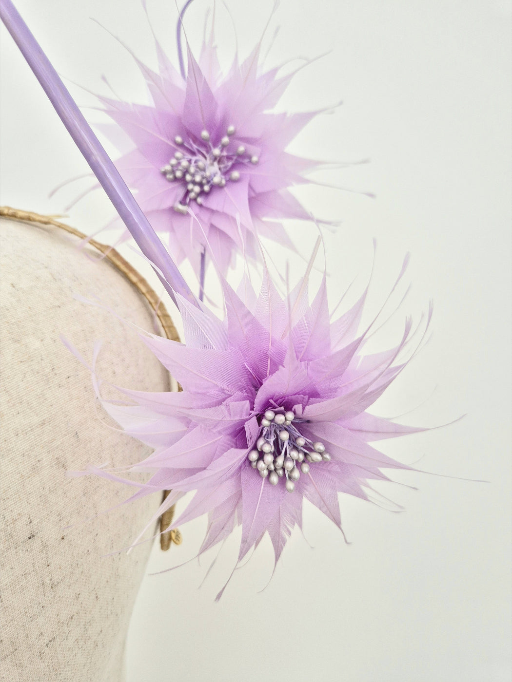 close up lilac feather flower headpiece