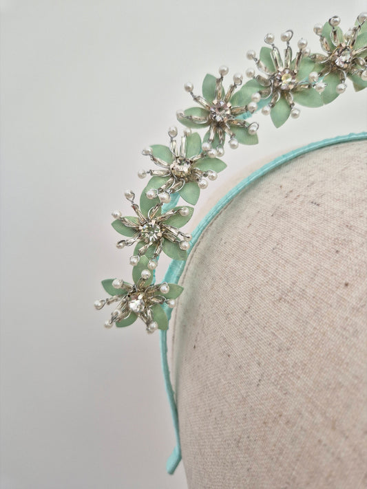close up mint green floral headpiece