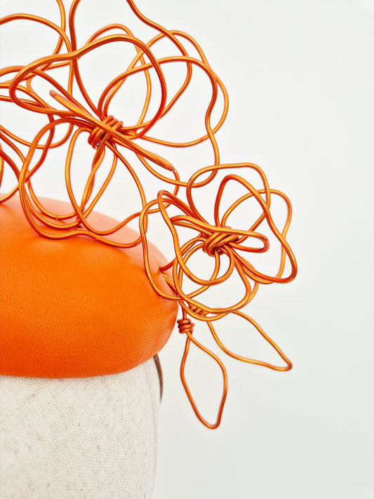 close up orange floral wirework