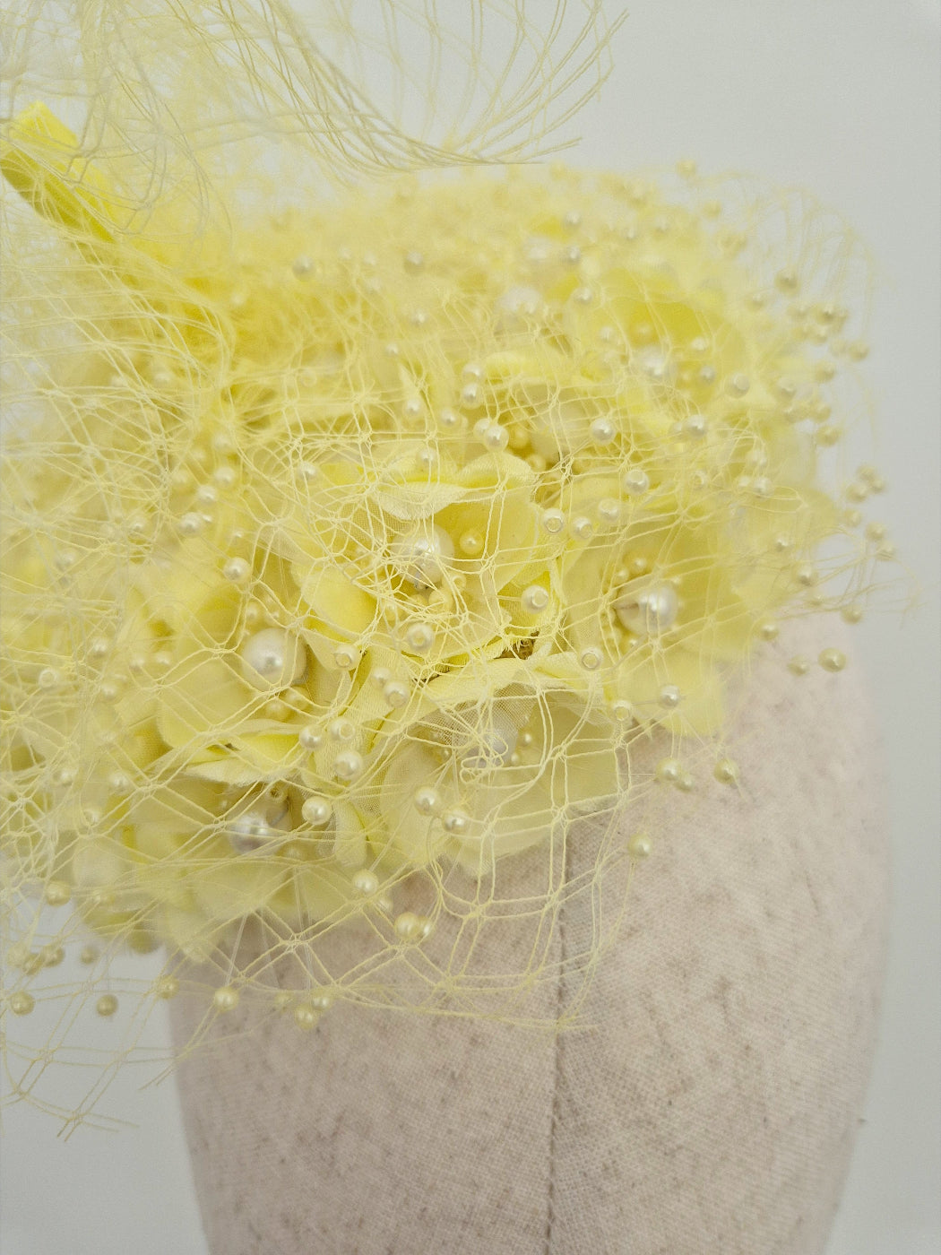 close up 3d pale yellow floral headpiece