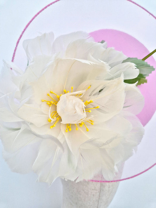 close up pink percher headpiece with feather flower