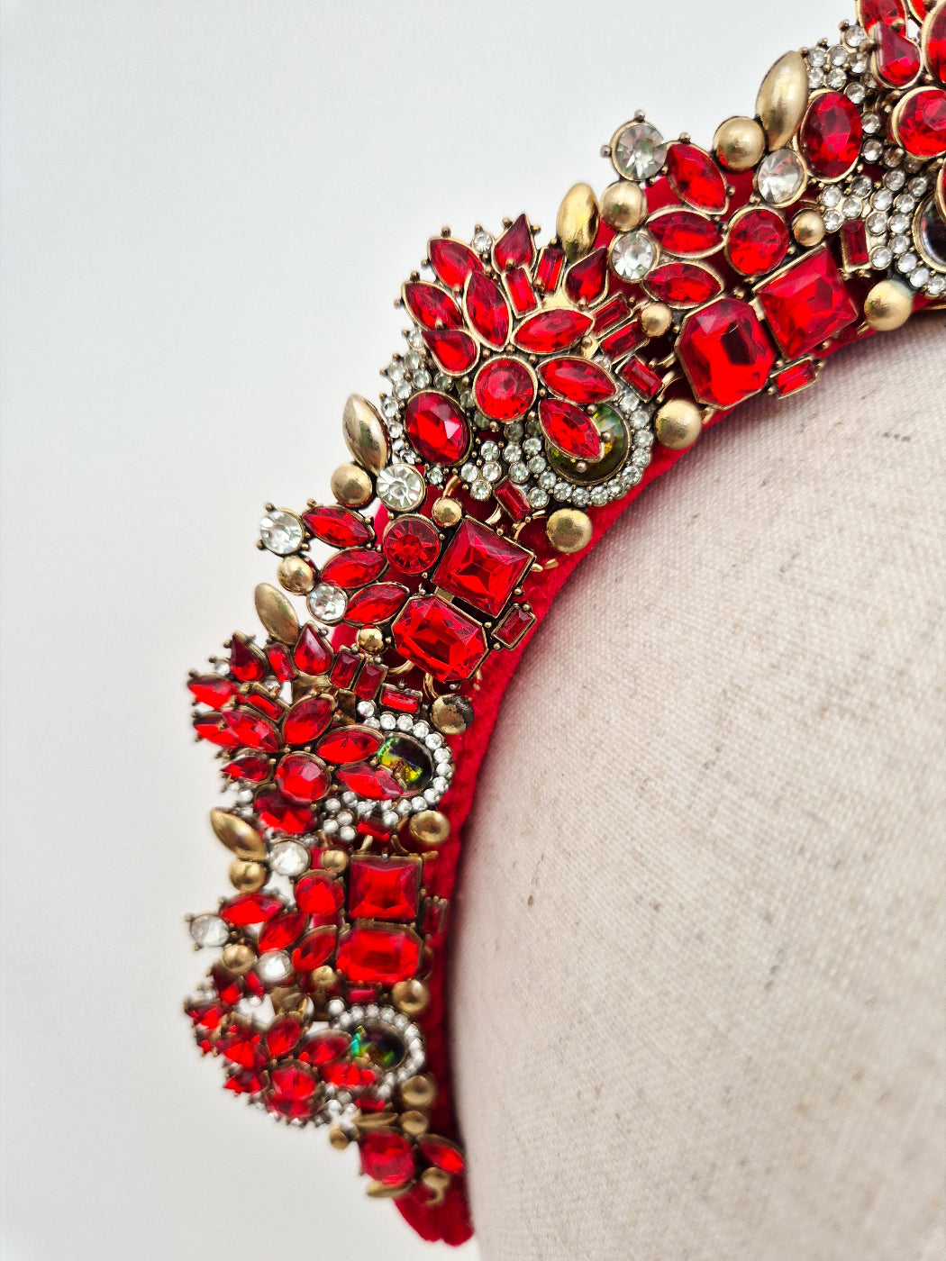 close up red rhinestone headpiece