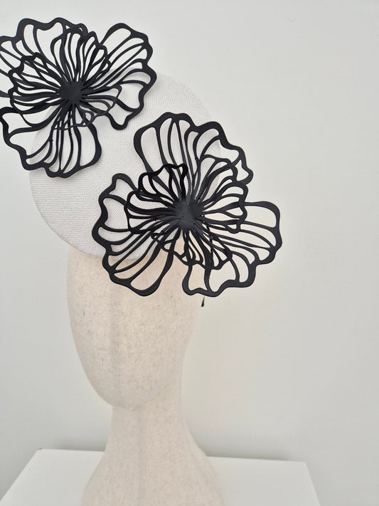 close up white percher headpiece with black flowers