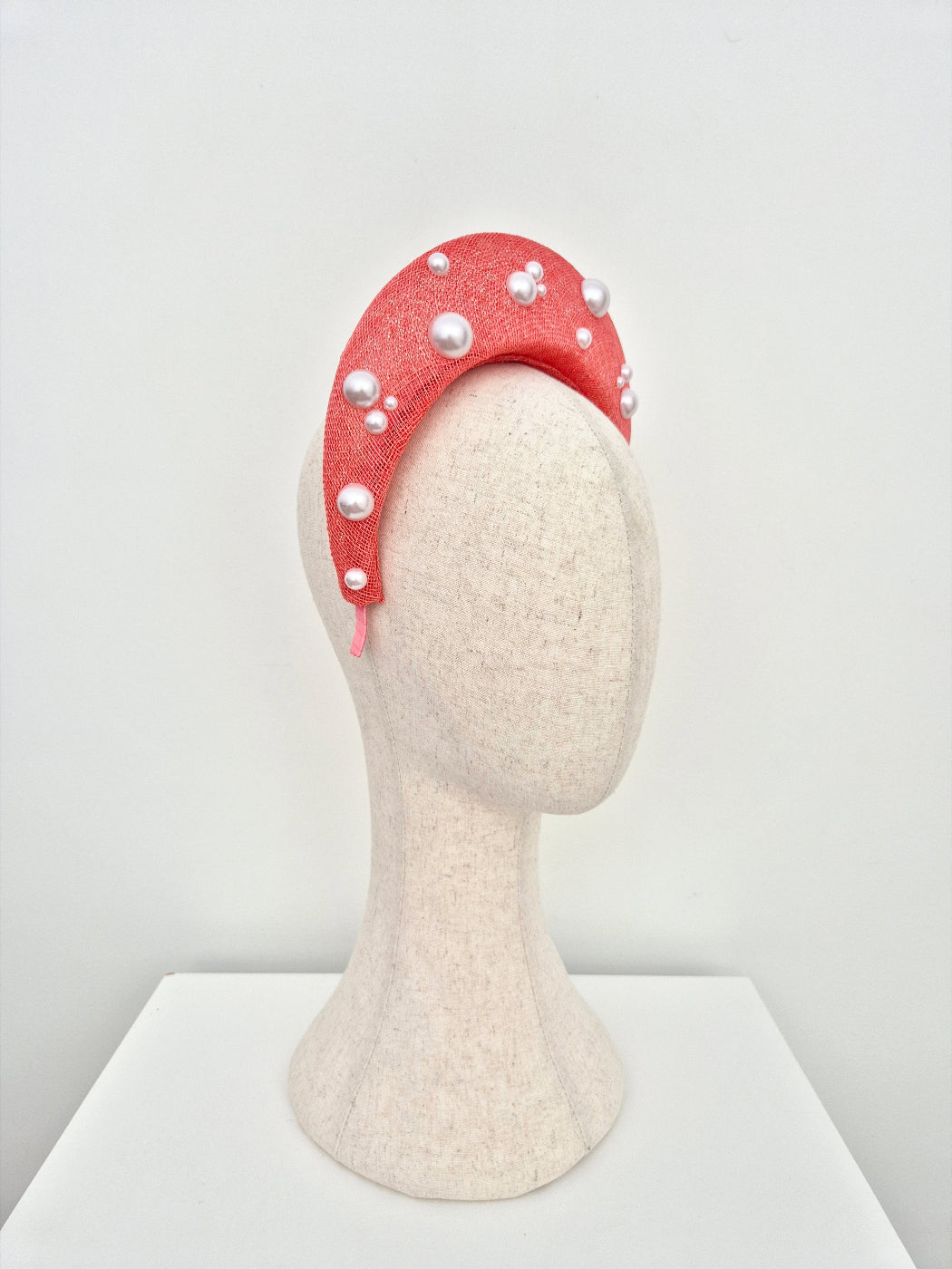 coral straw halo headpiece with pearls side view