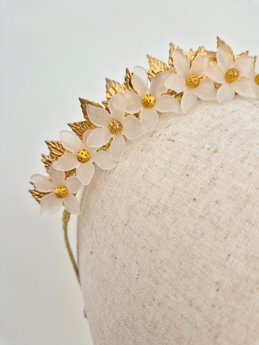 gold and white floral crown close up