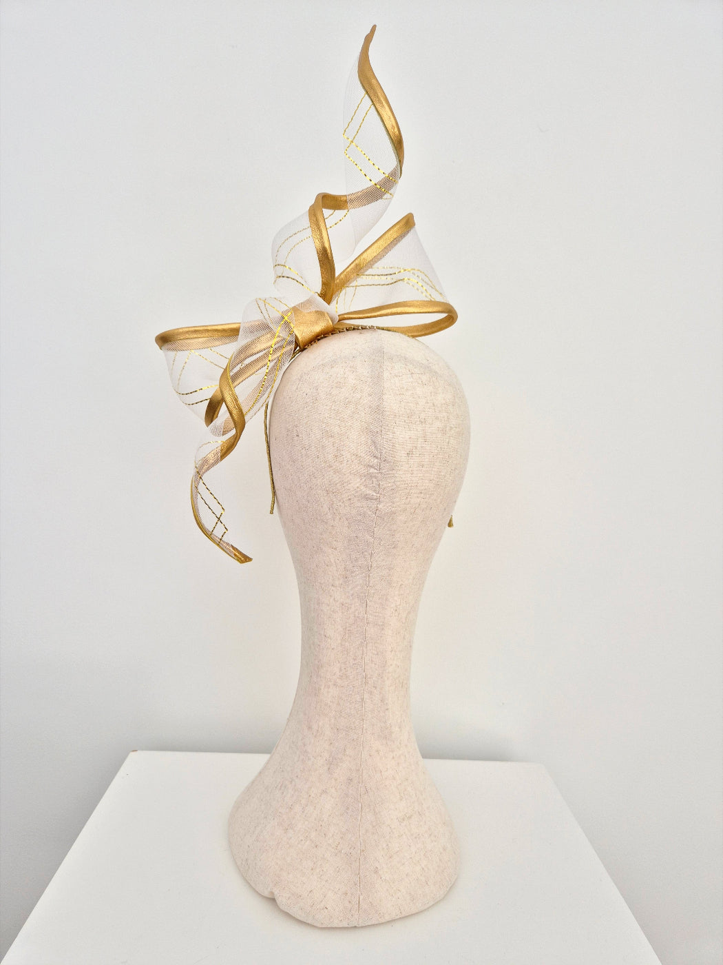 gold wired bow headpiece back view