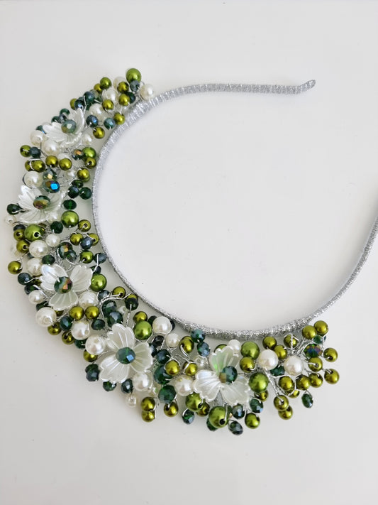 green pearl headband flat lay