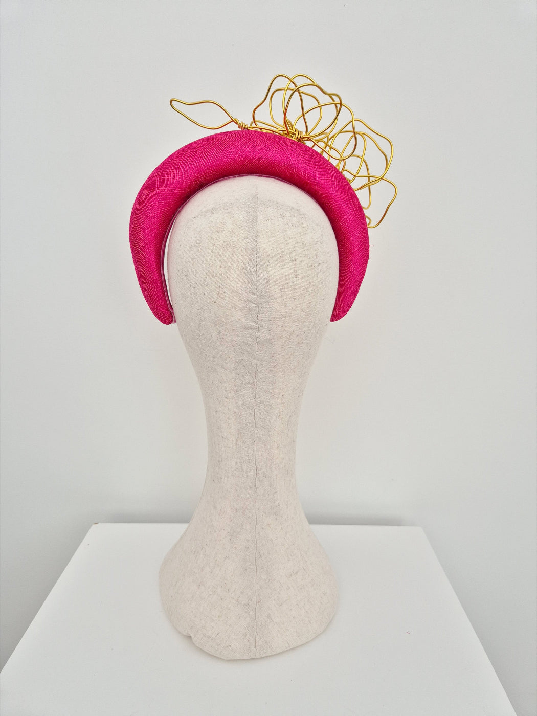 hot pink straw headband with gold wire flowers back view