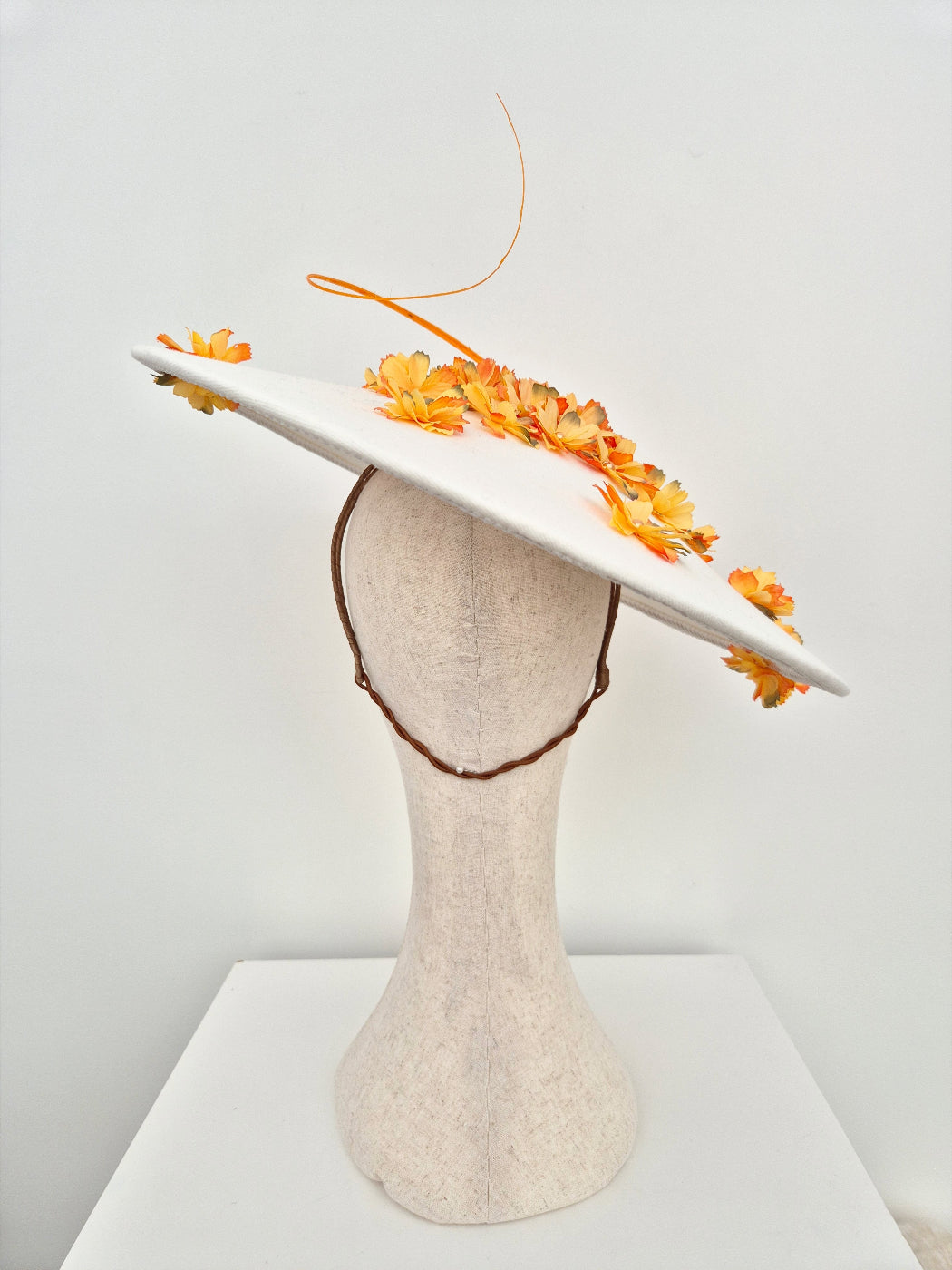 ivory coolie hat with orange petals back view