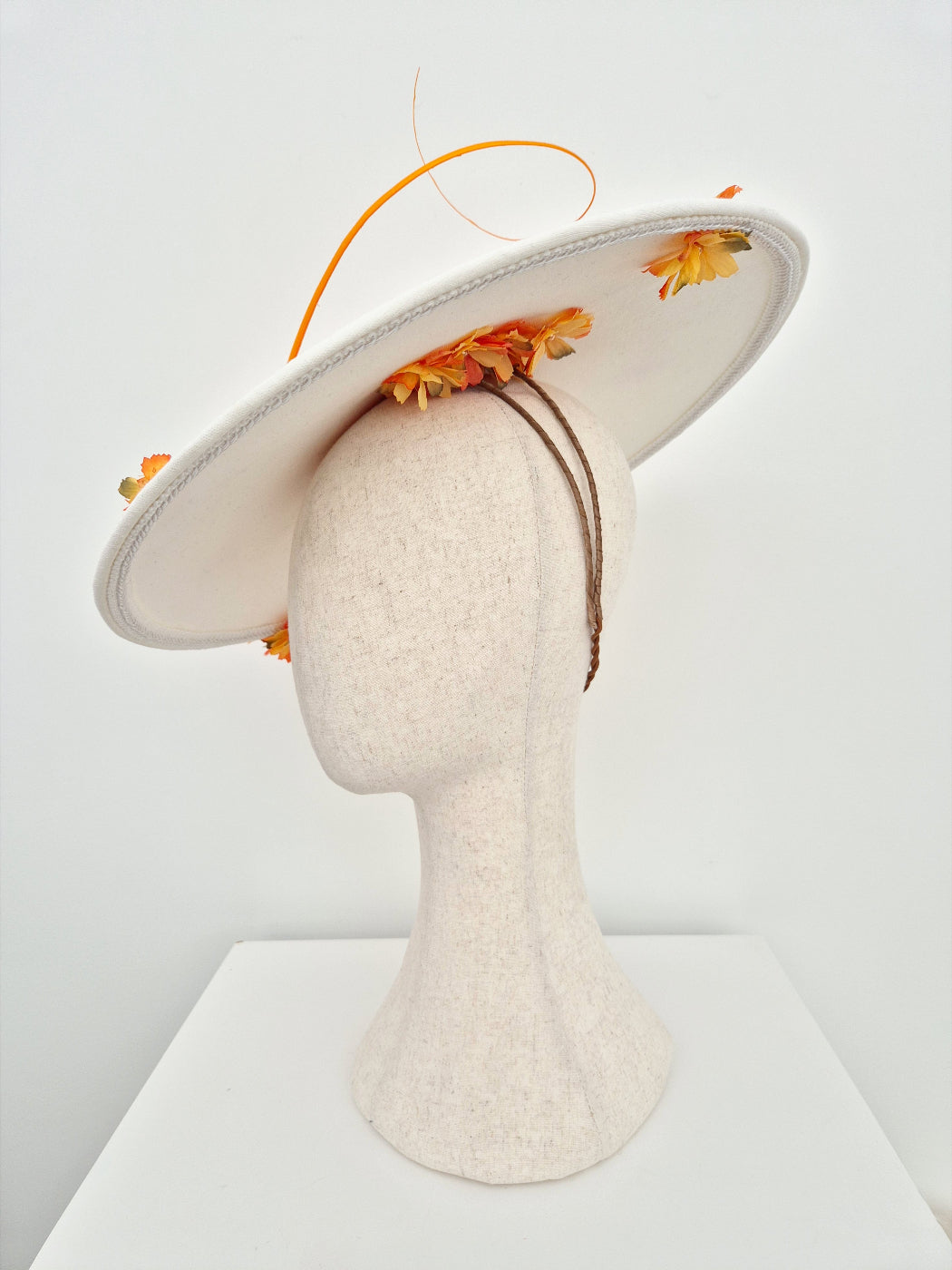 ivory coolie hat with orange petals underside