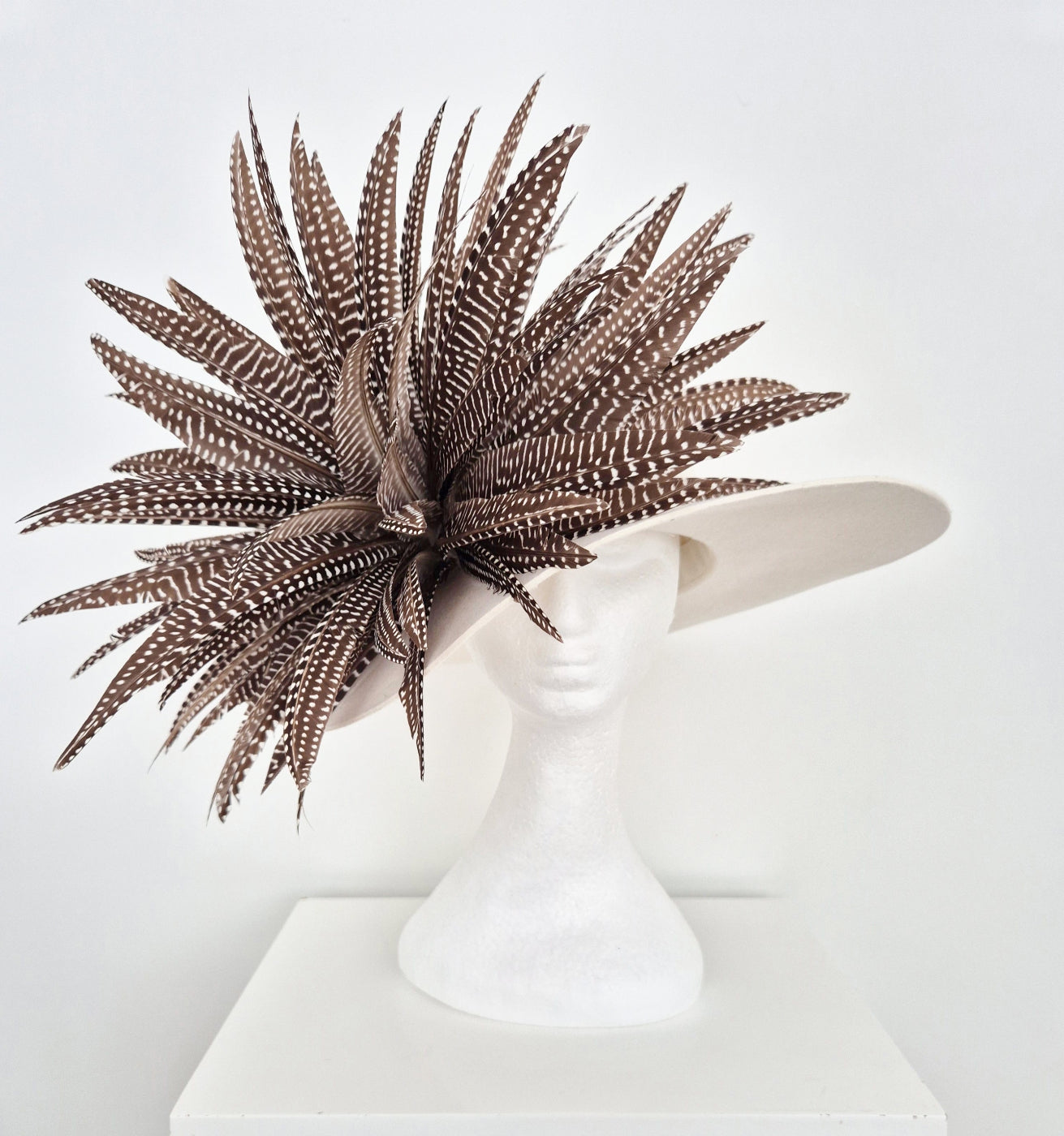 ivory felt hat with feathers