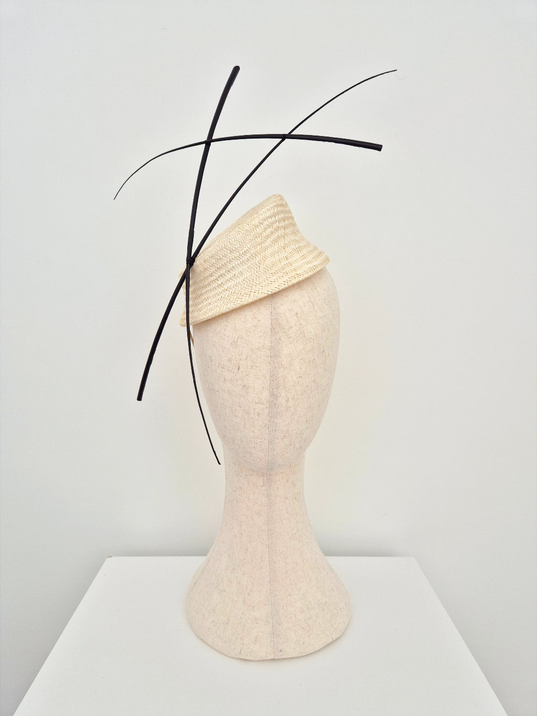 ivory straw headpiece with black quills