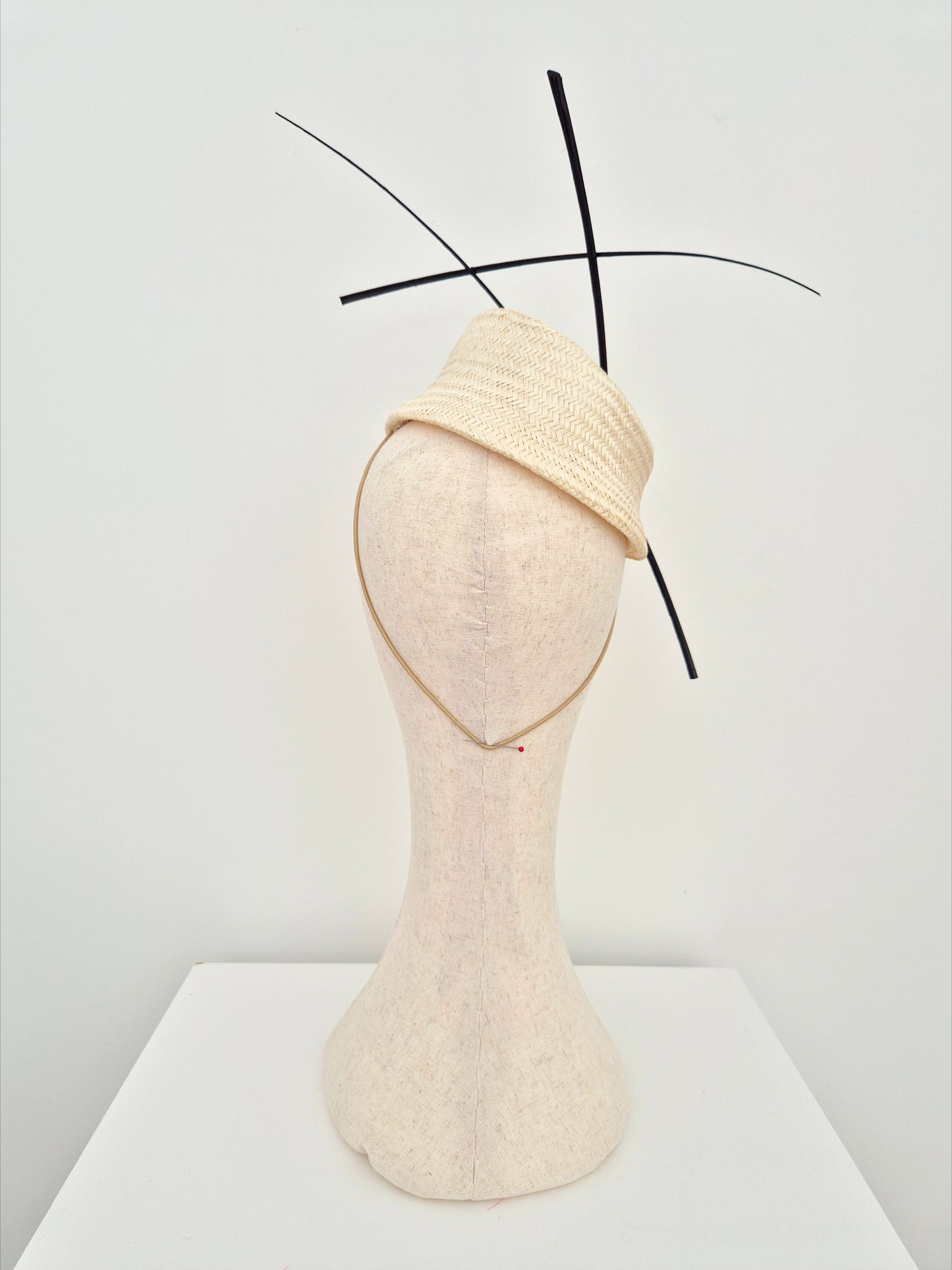 ivory straw slanted base headpiece with black quills back view