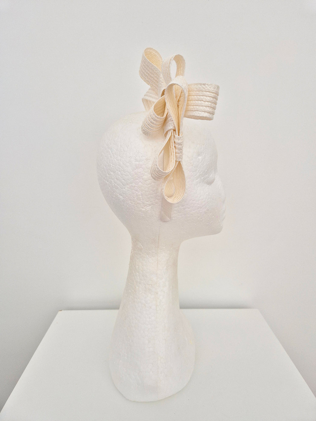 ivory straw stacked bow headpiece side view
