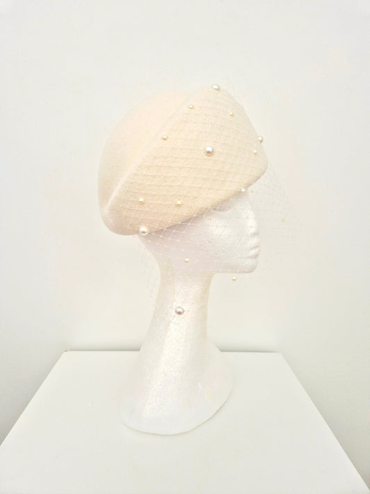 side front view ivory wool felt beret style headpiece