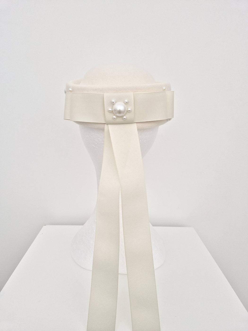 ivory pillbox back with bow