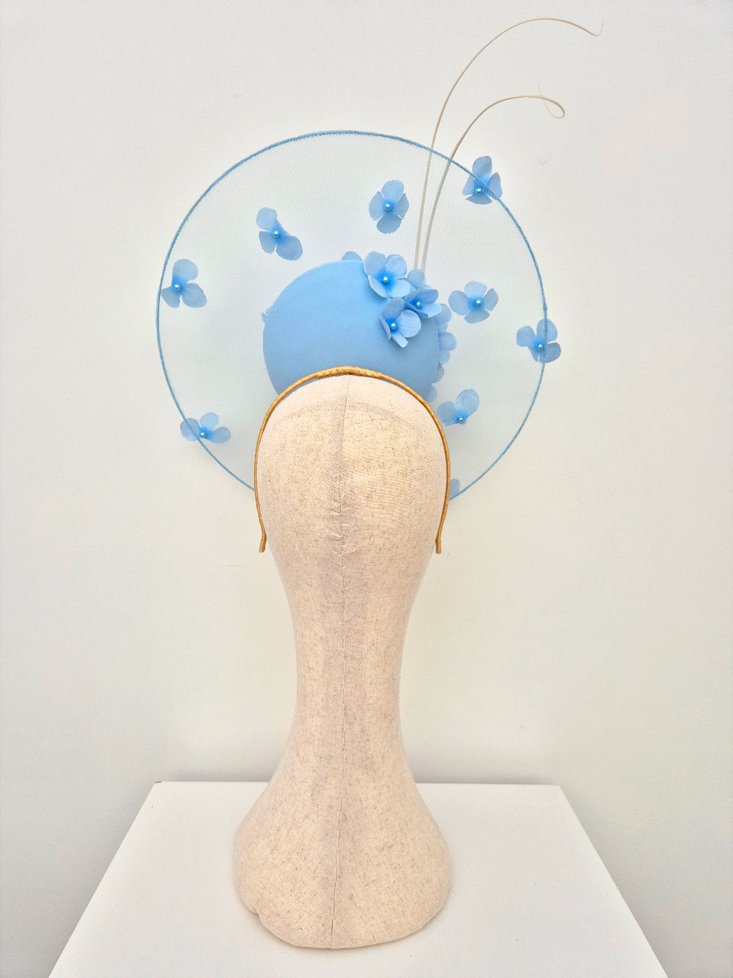 light blue satelite percher headpiece with flowers back view