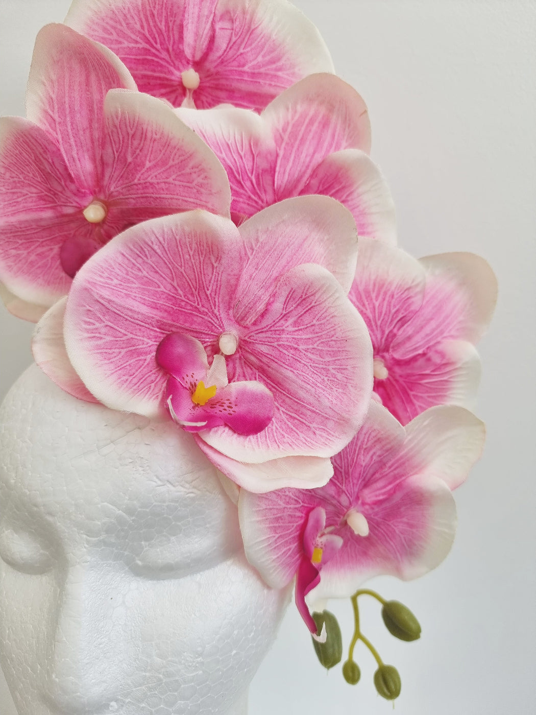 light pink floral orchid headpiece close up