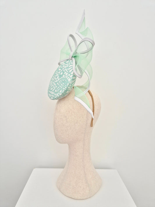 mint green and white sequin percher headpiece with bow