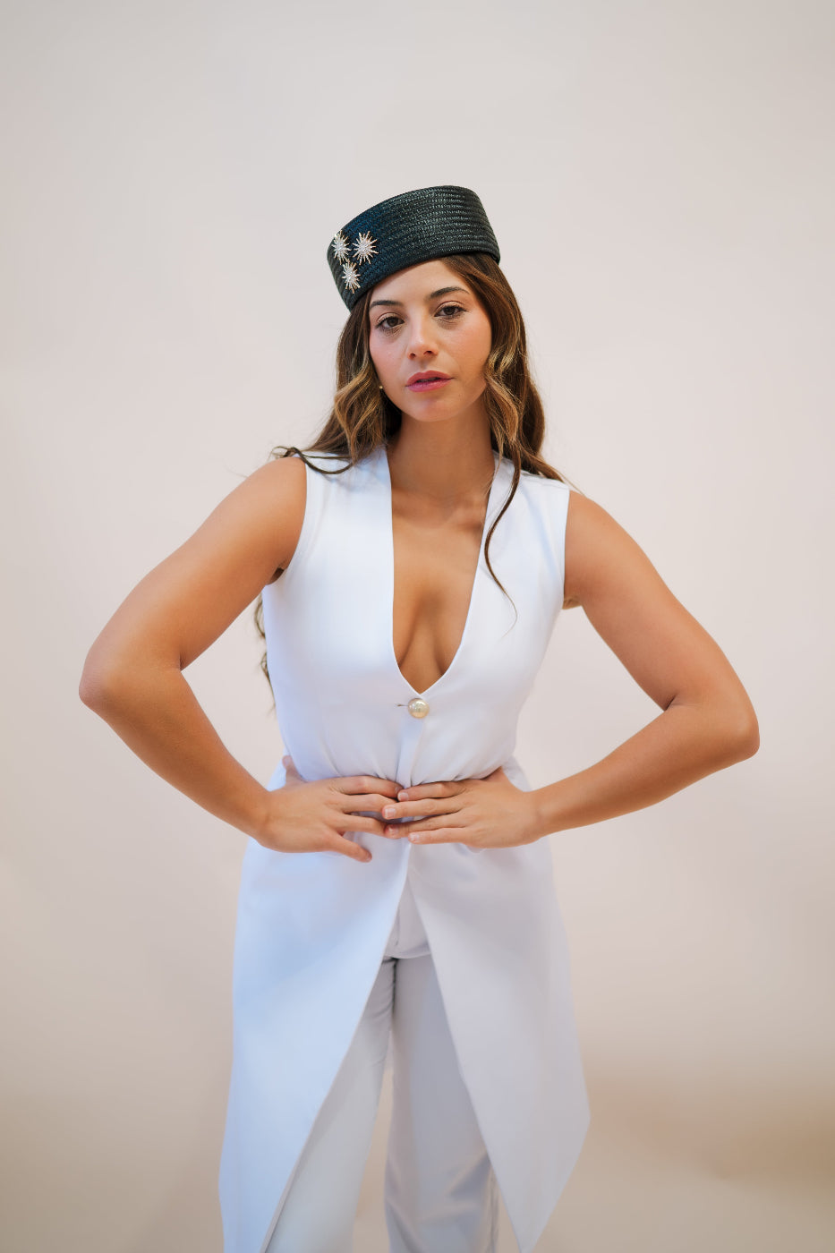 model wearing black pillbox