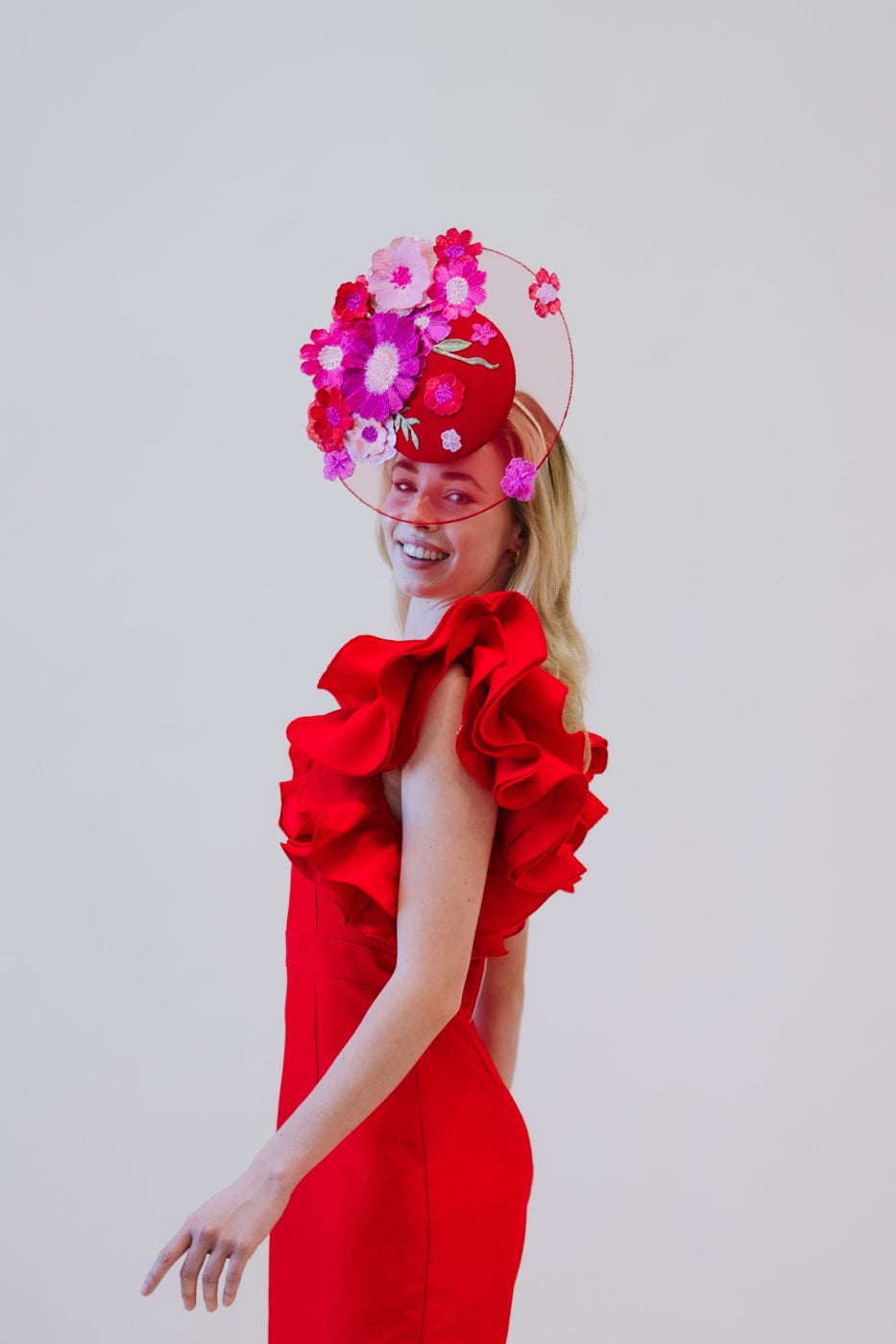 model wearing floral percher headpiece