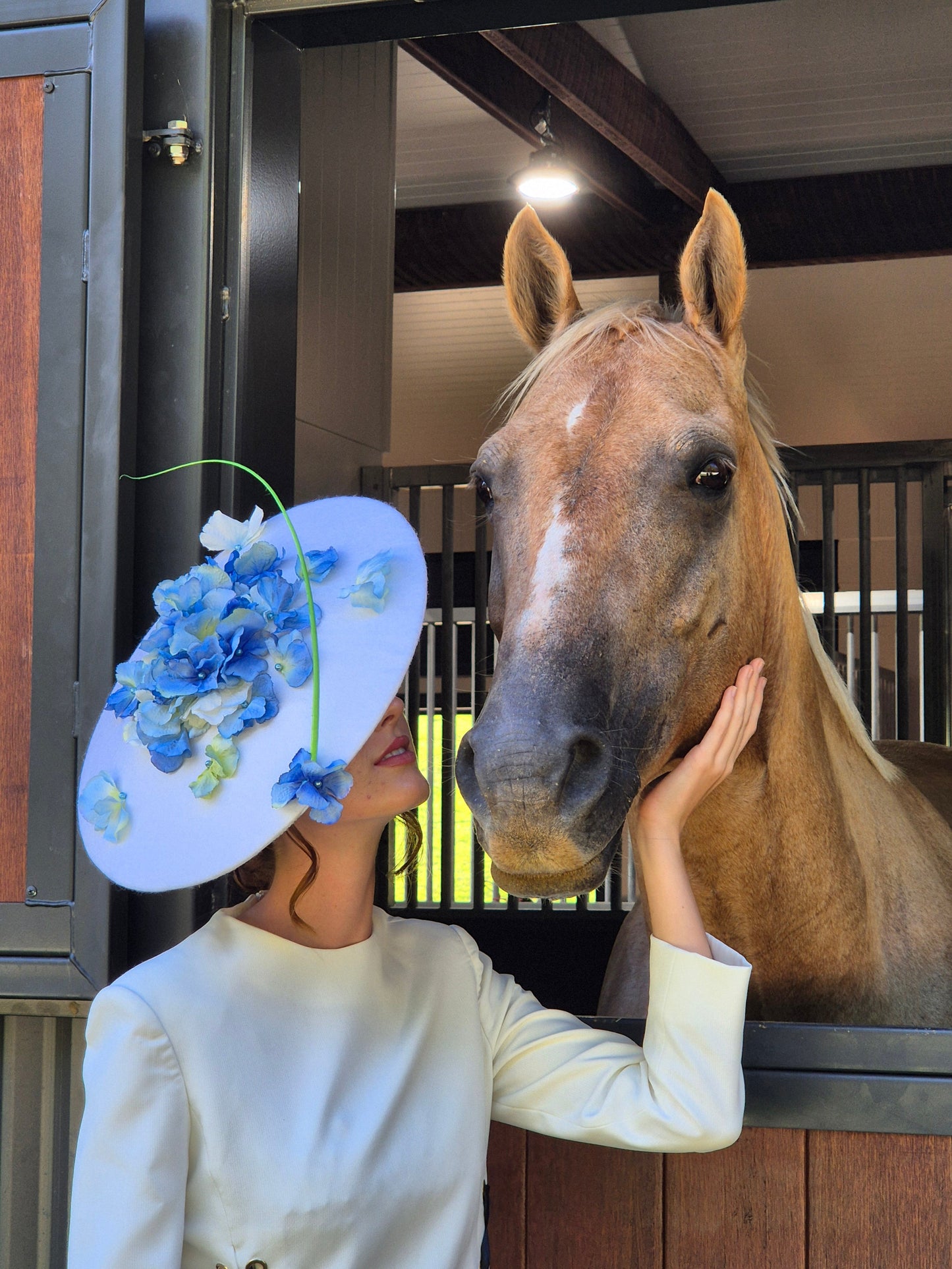 model wearing floral headpiece millinery